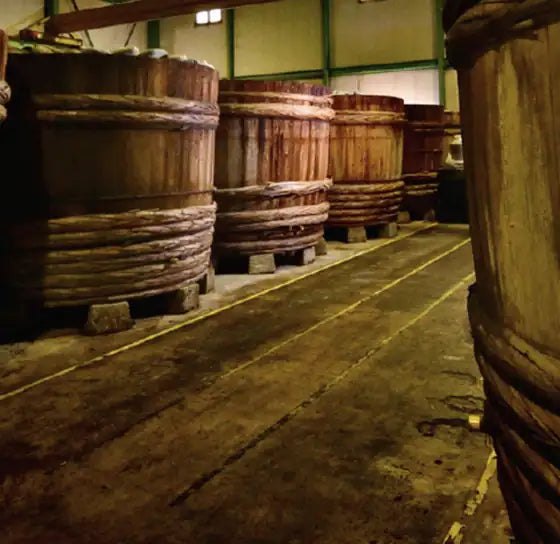 Wooden miso barrels in our kura